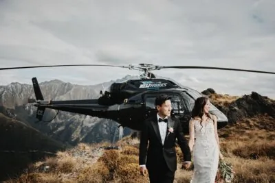 Kyoto Tokyo Japan Elopement Wedding Photographer, Planner & Videographer | A bride and groom standing in front of a helicopter.