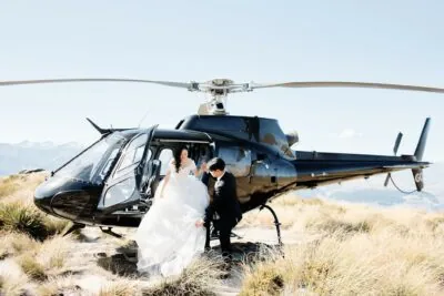 Kyoto Tokyo Japan Elopement Wedding Photographer, Planner & Videographer | Ayaka Morita, a talented photographer with an impressive portfolio, captures a captivating image of a bride and groom standing next to a helicopter.