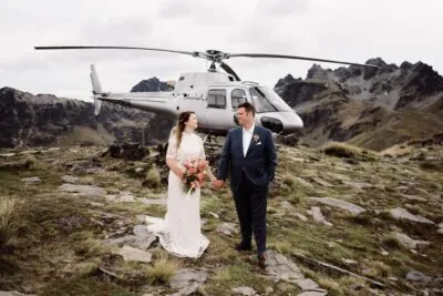 Kyoto Tokyo Japan Elopement Wedding Photographer, Planner & Videographer | Ayaka Morita showcasing her portfolio with a stunning image of a bride and groom standing in front of a helicopter.