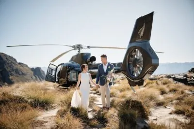 Kyoto Tokyo Japan Elopement Wedding Photographer, Planner & Videographer | Ayaka Morita, a bride and groom posing in front of a helicopter as part of her portfolio.