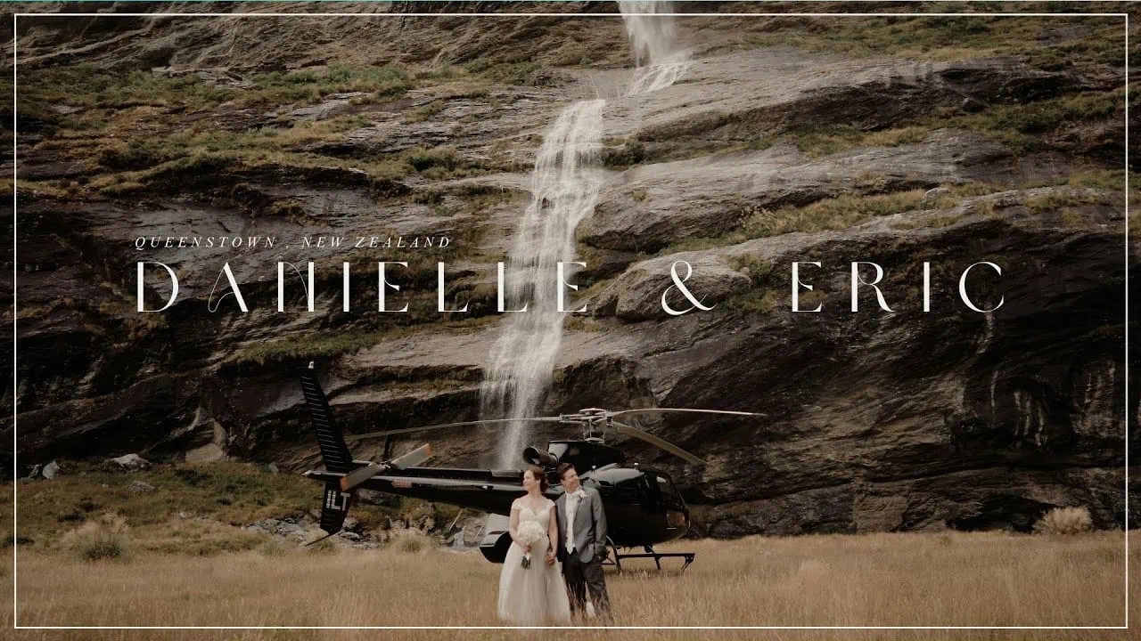 Queenstown New Zealand Elopement Wedding Photographer - Danielle & Eric's Queenstown elopement wedding captured in front of a stunning waterfall, with a helicopter in the background.
