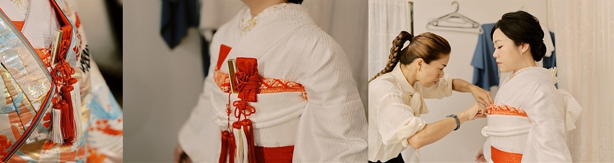 Kyoto Tokyo Japan Elopement Wedding Photographer, Planner & Videographer | A woman, captured by an elopement photographer, is gracefully putting on a kimono.