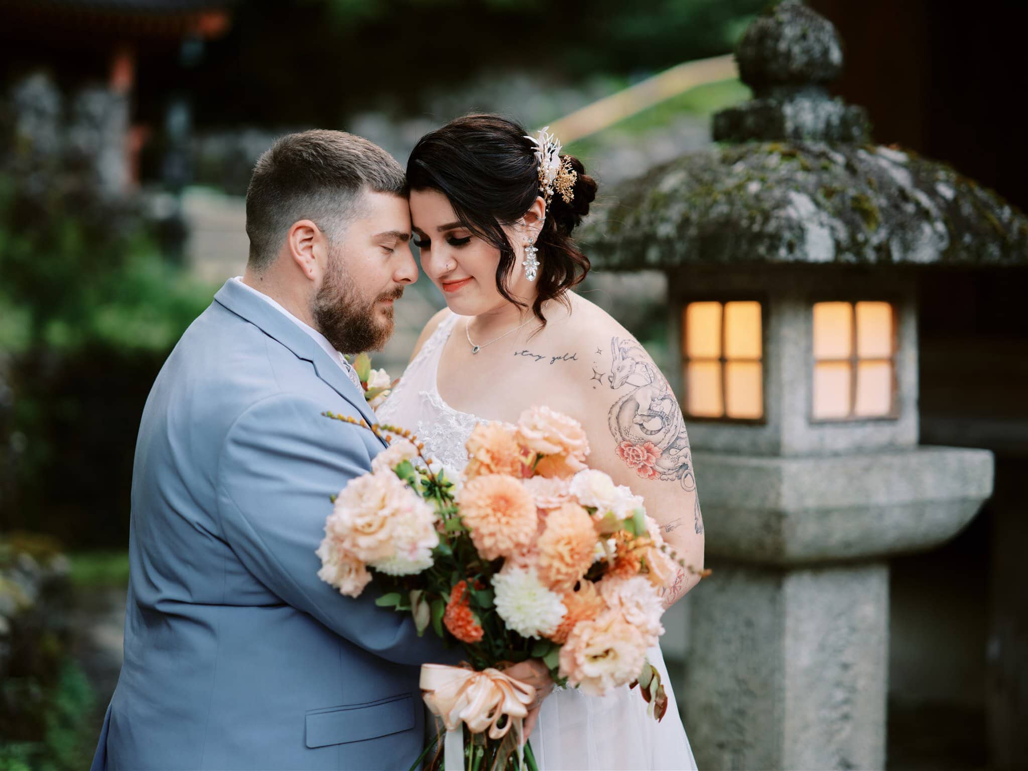 Kyoto Tokyo Japan Elopement Wedding Photographer, Planner & Videographer | A bride and groom standing in front of lanterns at a Japanese wedding captured beautifully by a skilled photographer specializing in Japan elopements.
