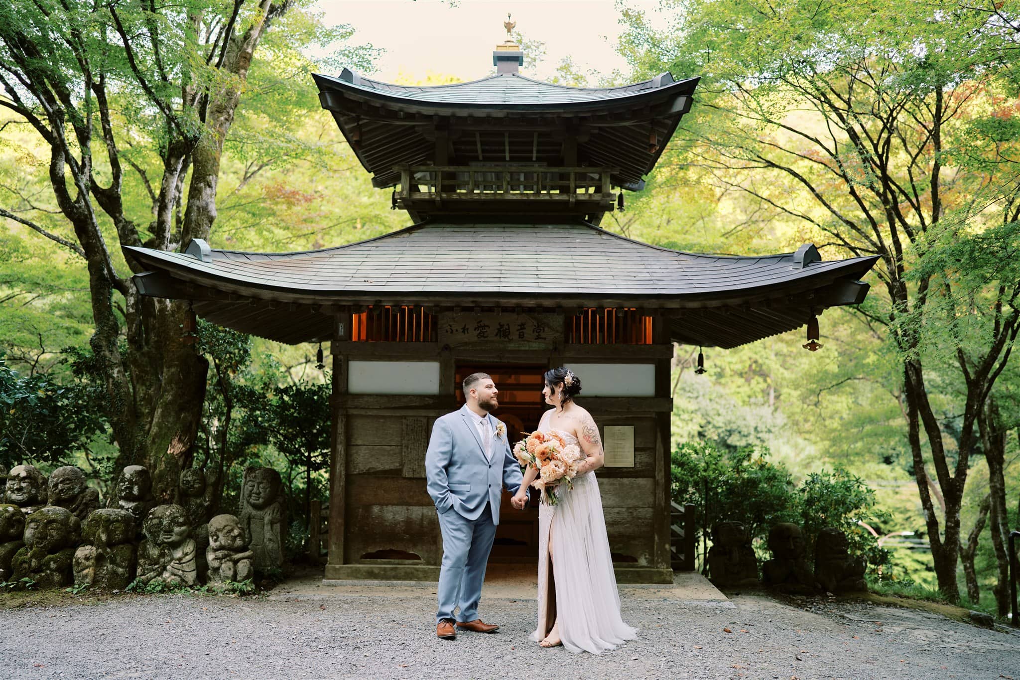 Kyoto Tokyo Japan Elopement Wedding Photographer, Planner & Videographer | A japan elopement couple, beautifully captured by their photographer, standing in front of a pagoda.
