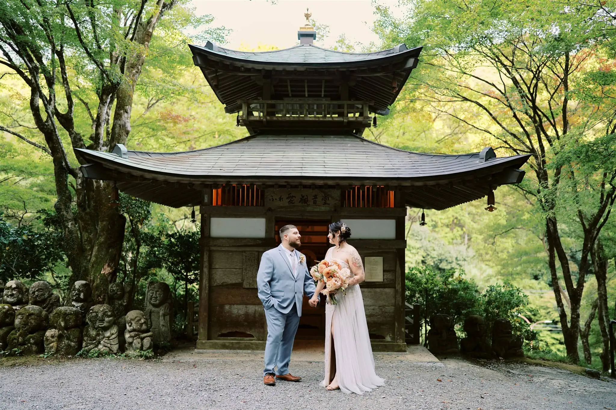 Kyoto Tokyo Japan Elopement Wedding Photographer, Planner & Videographer | A japan elopement couple, beautifully captured by their photographer, standing in front of a pagoda.