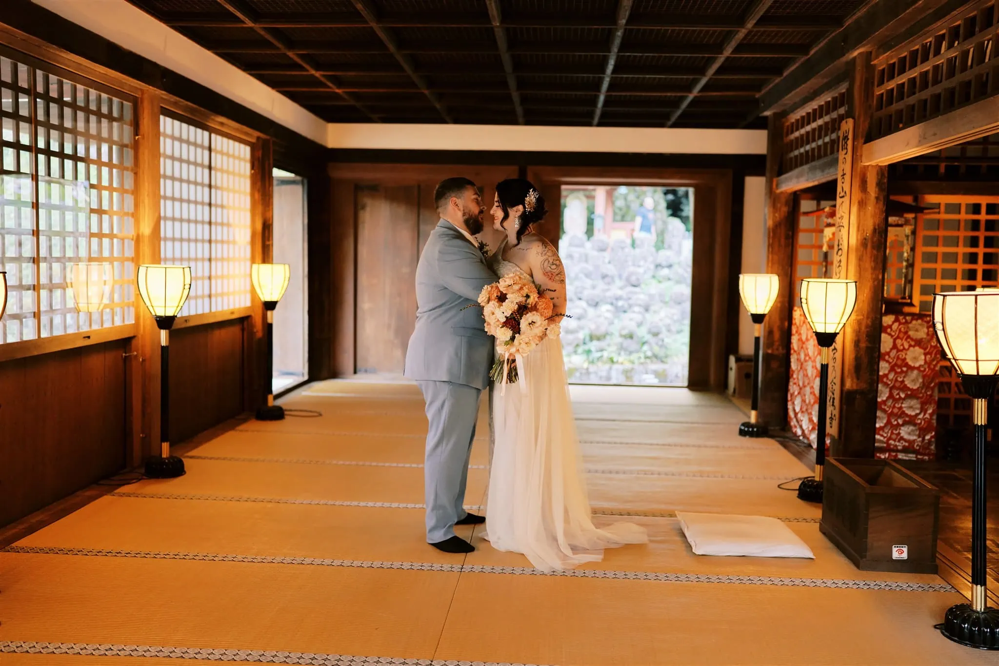 Kyoto Tokyo Japan Elopement Wedding Photographer, Planner & Videographer | A photographer capturing a bride and groom kissing during their Japan elopement in a traditional Japanese room.