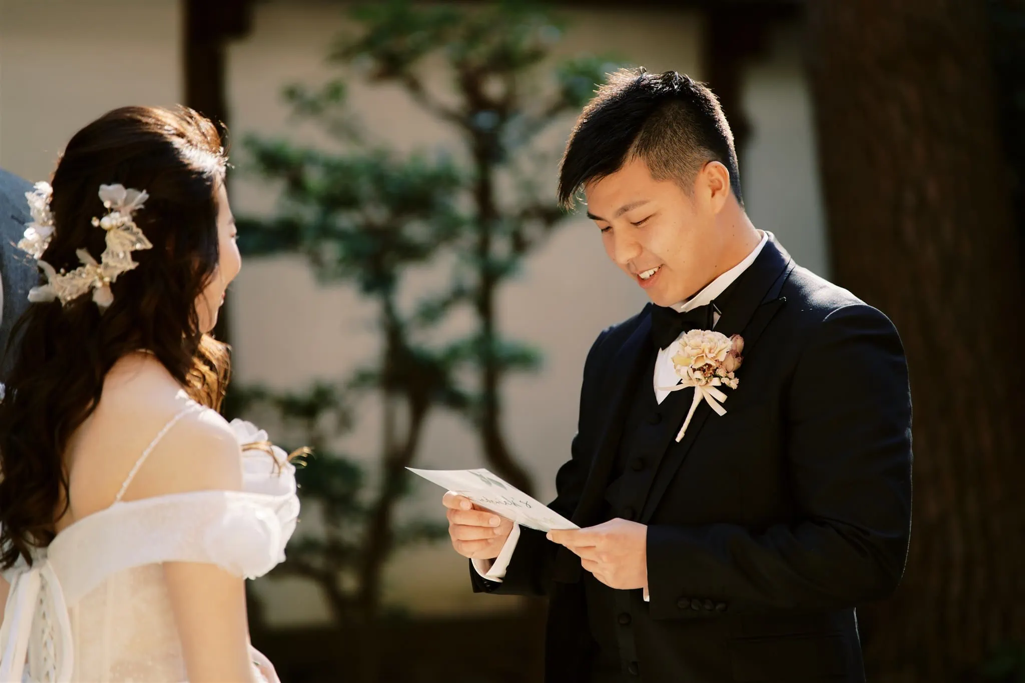Kyoto Tokyo Japan Elopement Wedding Photographer, Planner & Videographer | A Japanese bride and groom reading their wedding vows captured by an elopement photographer.