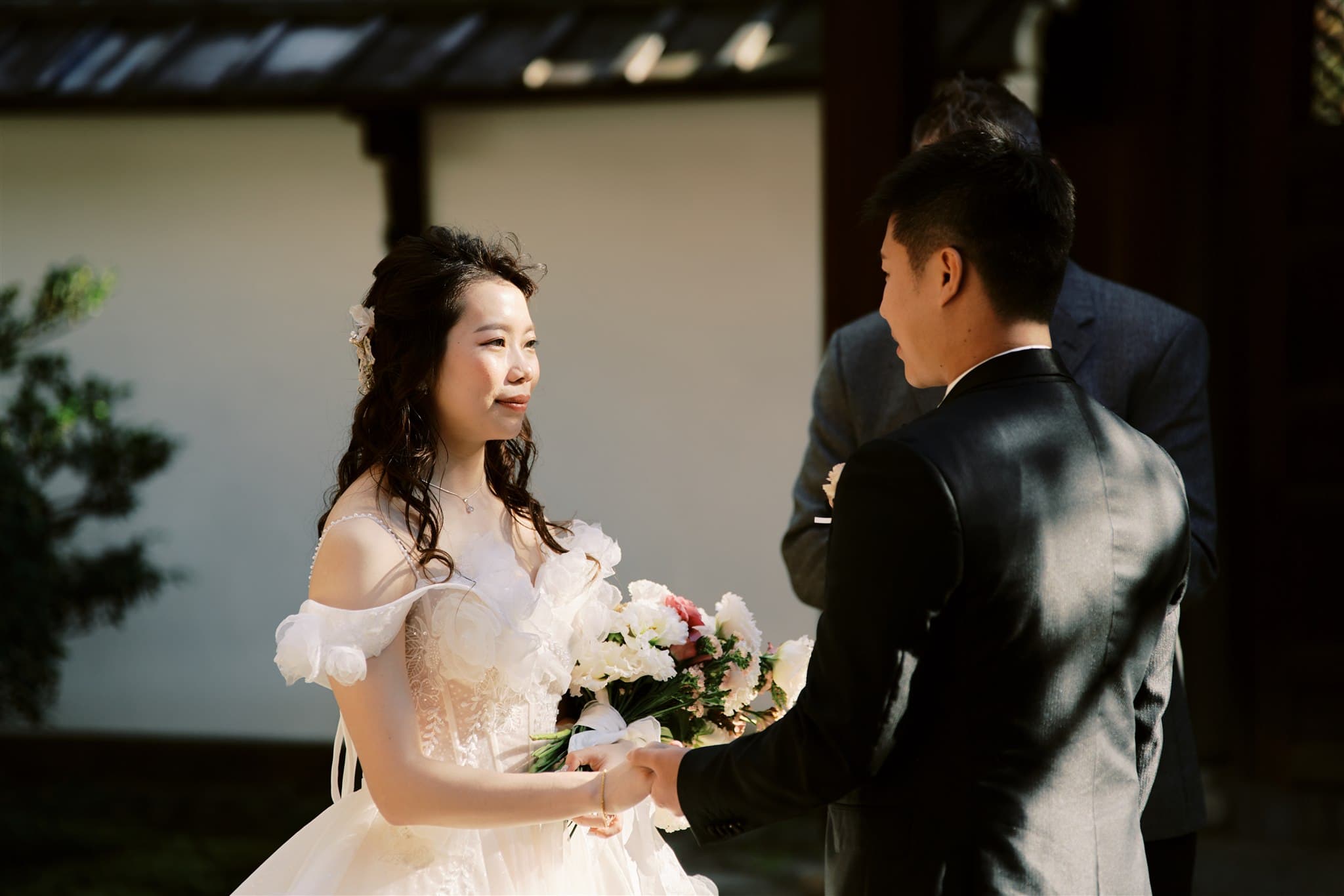Kyoto Tokyo Japan Elopement Wedding Photographer, Planner & Videographer | A bride and groom are standing next to each other, captured by a skilled Japan elopement photographer at a beautiful wedding ceremony.