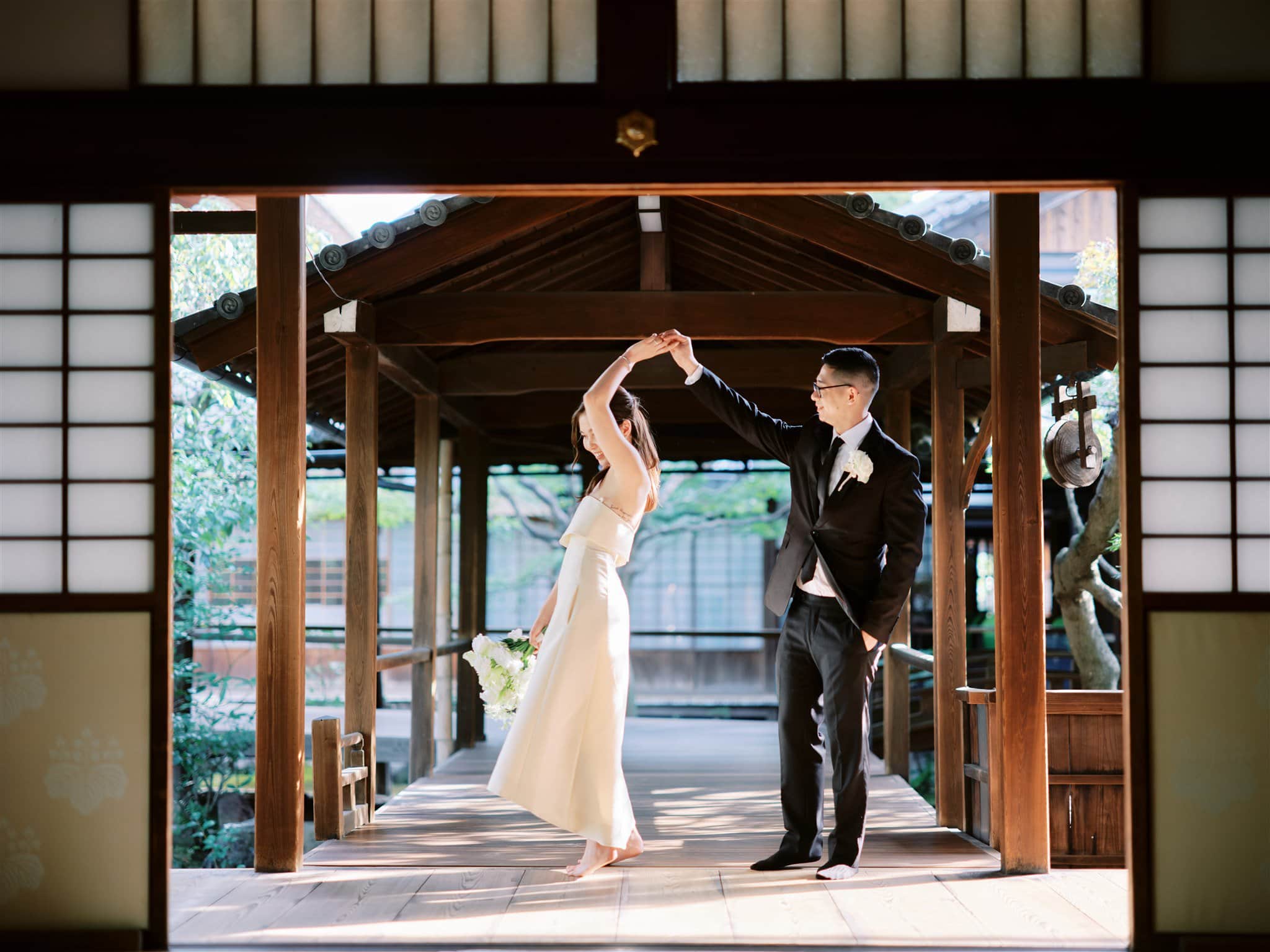 Kyoto Tokyo Japan Elopement Wedding Photographer, Planner & Videographer | A bride and groom elegantly dancing in a traditional Japanese house during their Japan elopement.