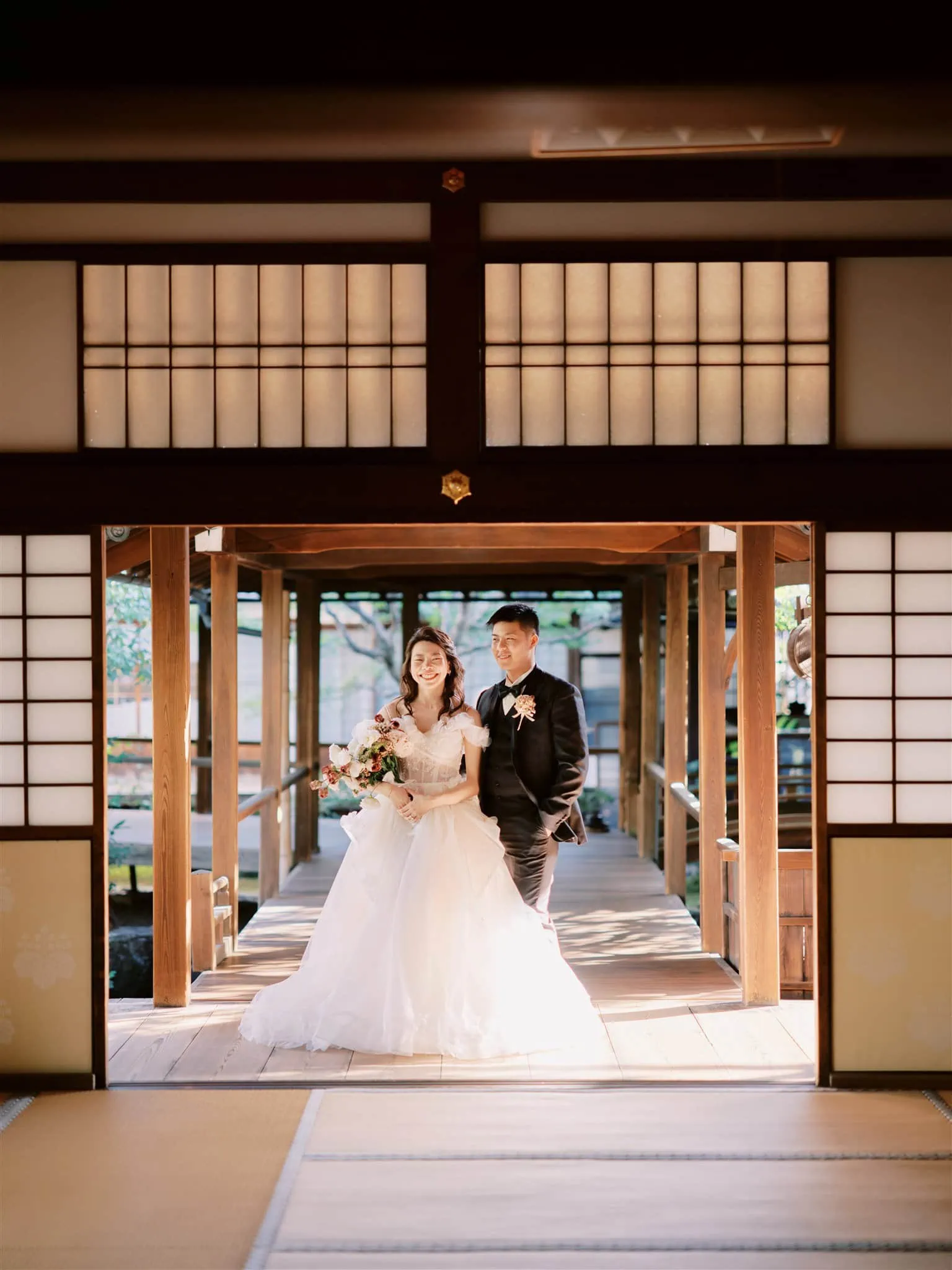 Kyoto Tokyo Japan Elopement Wedding Photographer, Planner & Videographer | A Japanese house serves as the picturesque backdrop for a bride and groom captured by a talented elopement photographer in Japan.