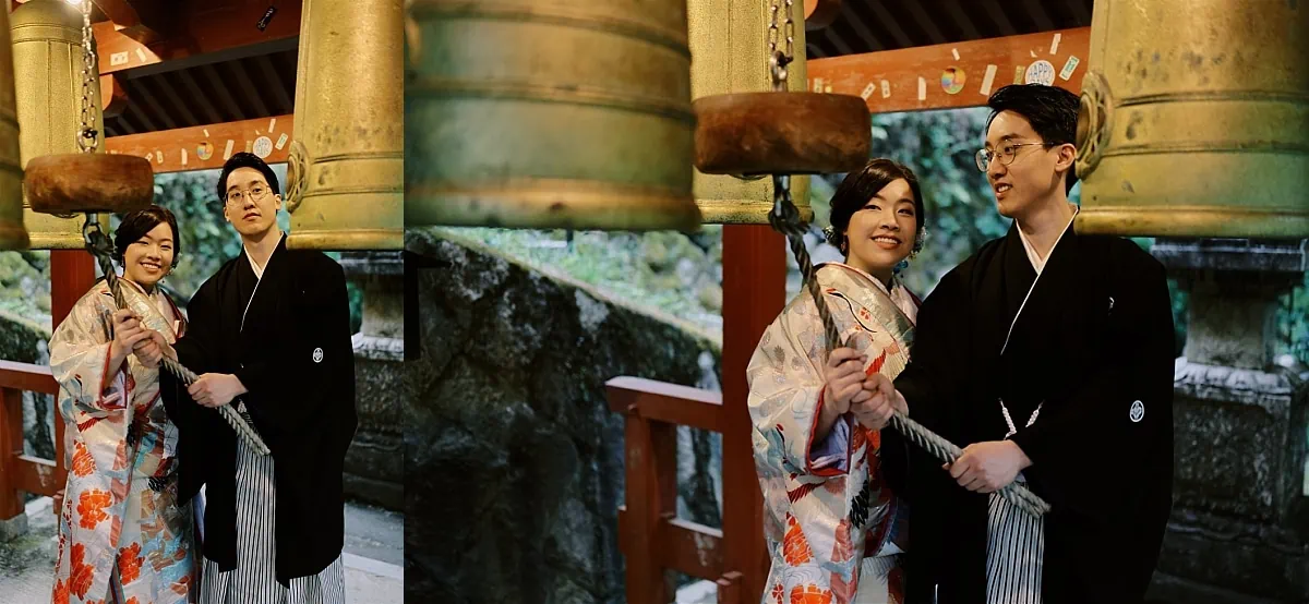 Kyoto Tokyo Japan Elopement Wedding Photographer, Planner & Videographer | A man and woman, elegantly dressed in kimono, pose alongside a majestic bell.