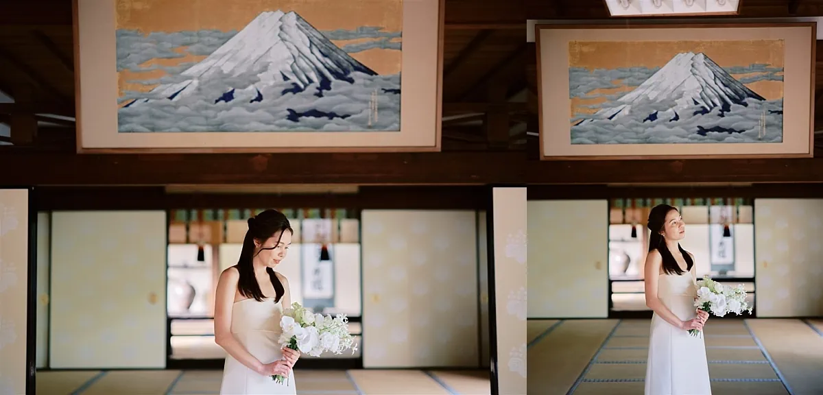 Kyoto Tokyo Japan Elopement Wedding Photographer, Planner & Videographer | A bride in a white dress standing in front of a painting of Mount Fuji during her Japan elopement.