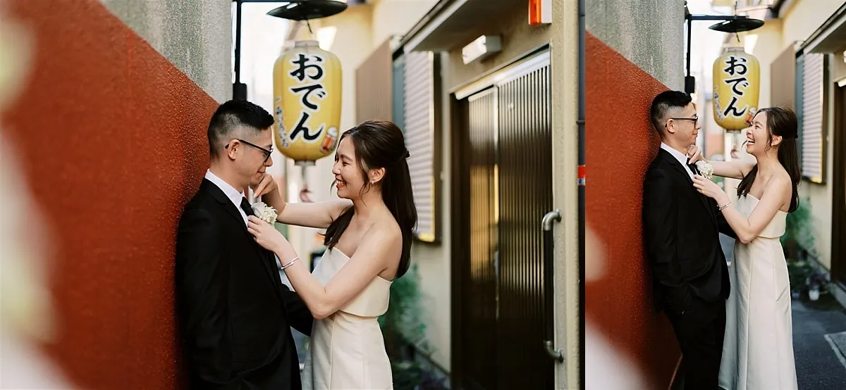 Kyoto Tokyo Japan Elopement Wedding Photographer, Planner & Videographer | A beautiful Japan elopement captures the touching moment of a bride and groom sharing a tender kiss in front of a traditional Japanese sign.