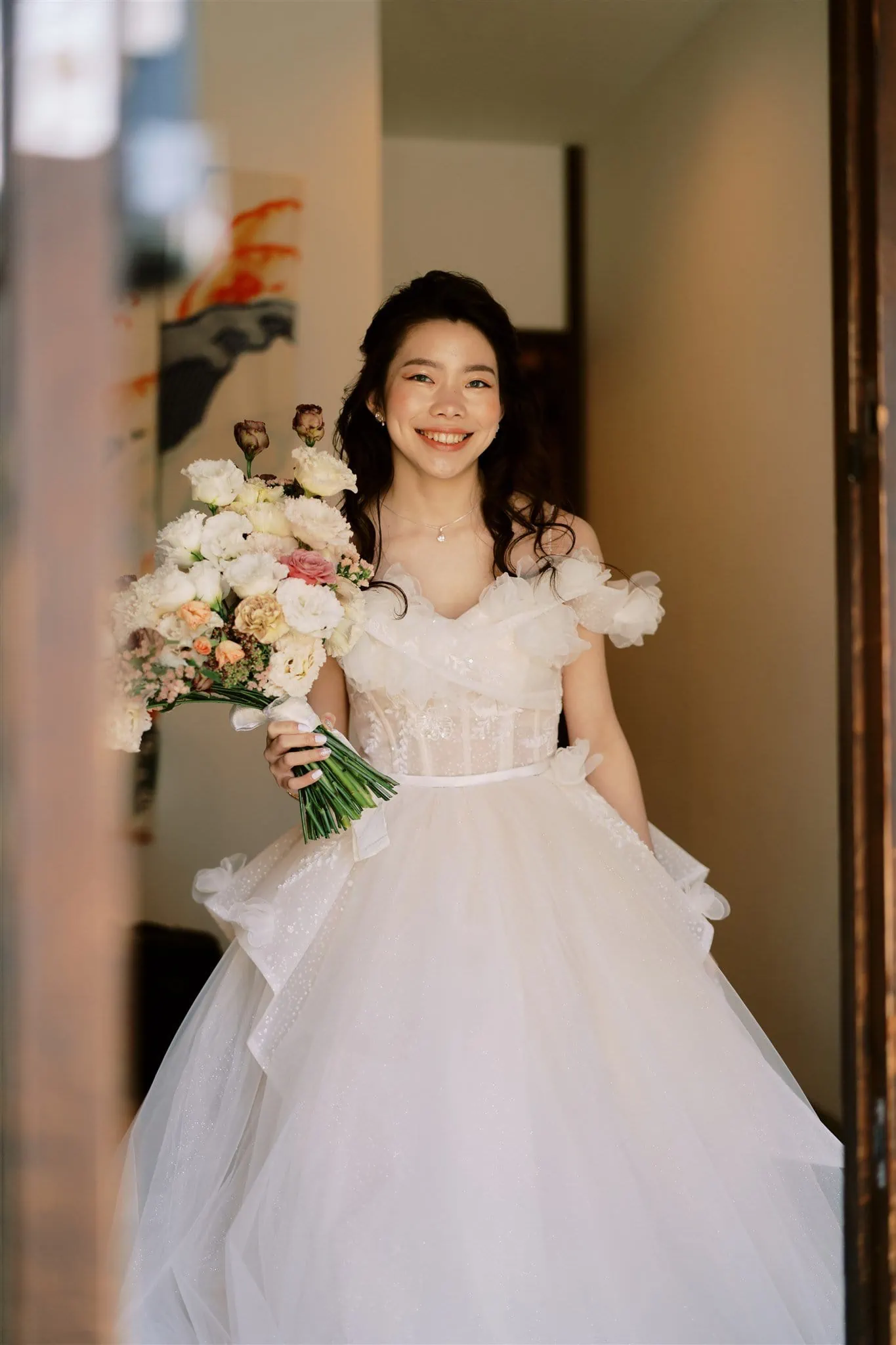 Kyoto Tokyo Japan Elopement Wedding Photographer, Planner & Videographer | A Japanese bride in a white wedding dress holding a bouquet, captured beautifully by an elopement photographer.