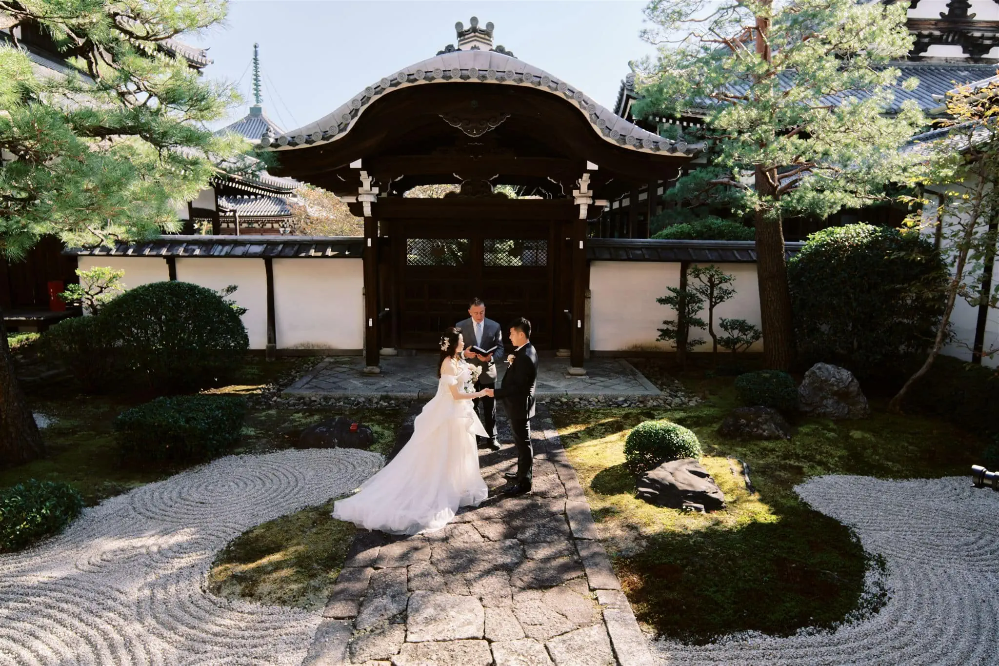 Kyoto Tokyo Japan Elopement Wedding Photographer, Planner & Videographer | A Japan Elopement featuring a bride and groom standing in front of a Japanese pagoda.