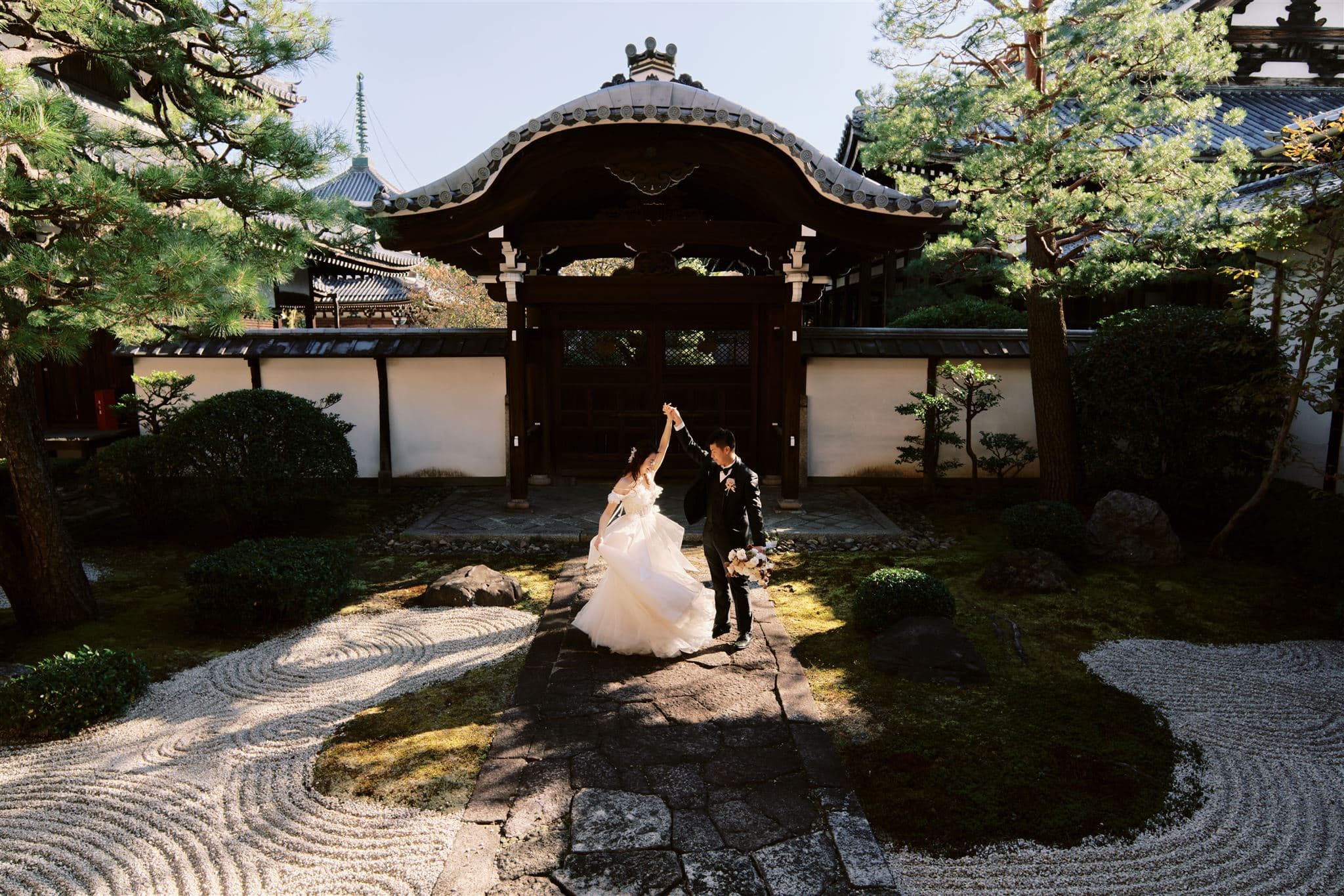 Japan Elopement Wedding Photographer, Planner & Videographer | bride and groom walking through a japanese garden during their Kyoto Japan Wedding & Elopement Package.